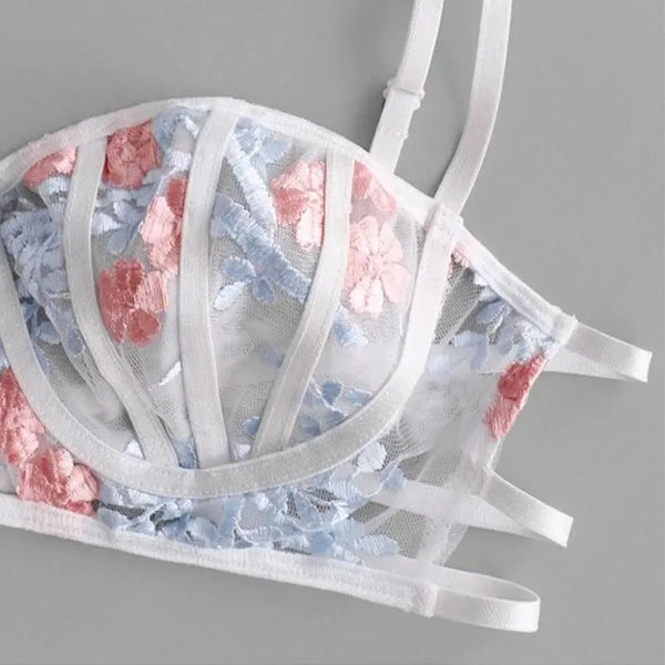 Her ADULOTY Floral Embroidered Caged Bralette and Thong Set.